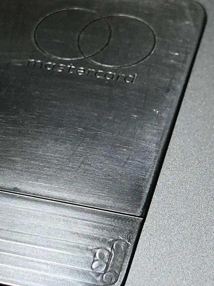 Close-up of the stripped, bare-titanium Apple Card