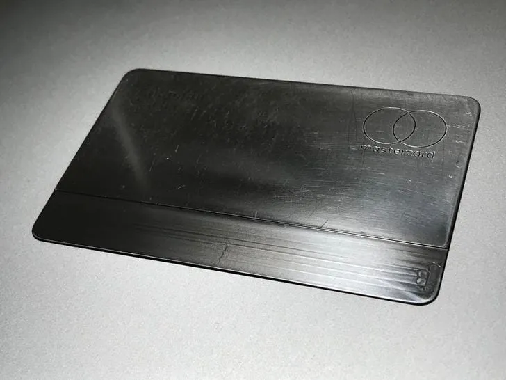 The engraved name and card number on the stripped Apple Card