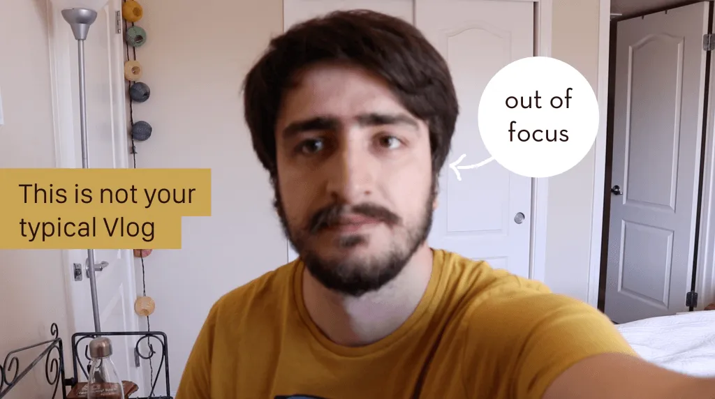 A vlog thumbnail: me looking into the camera in a yellow t-shirt at home, captioned "This is not your typical Vlog", with an arrow pointing at my face labelled "out of focus".